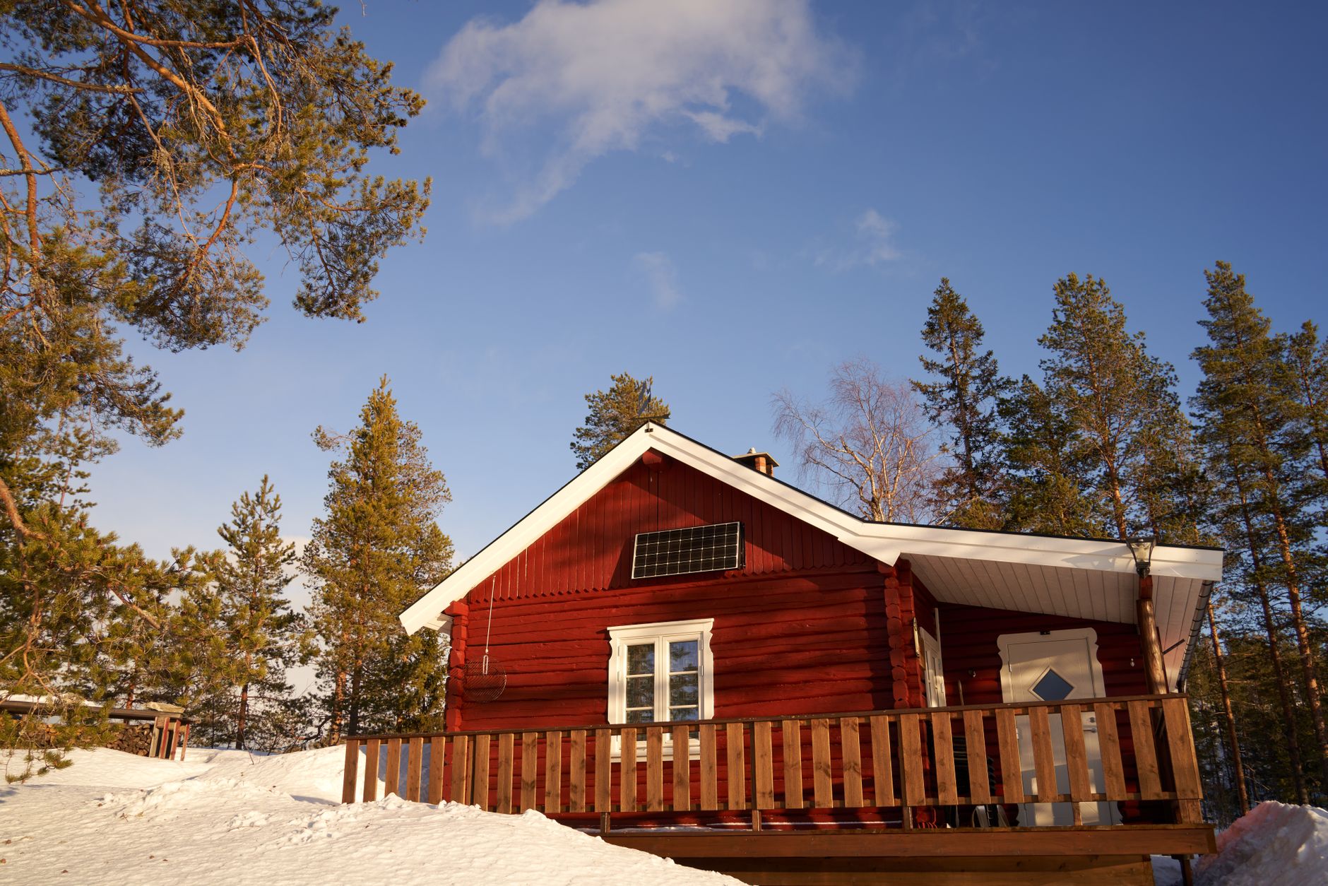 Off grid cabin with solar panels and garden